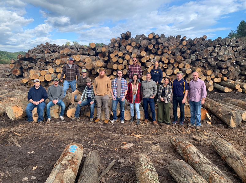 Wood Science and Technology students group photo at lumber yard.