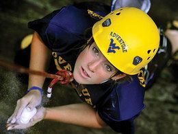 image of student rock climbing